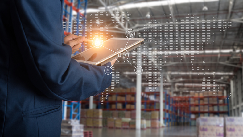 Logistic and transport concept : Businessman manager using tablet check and control and planning for Modern Trade warehouse logistics.